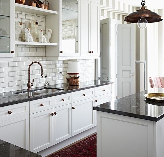 A White Subway Tile Kitchen with a Persian Rug