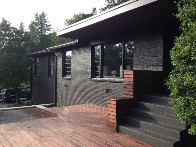 Black Siding House Made of Bricks