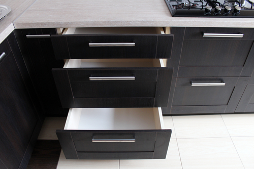 Kitchen furniture. Brown kitchen cabinets. Room design.
