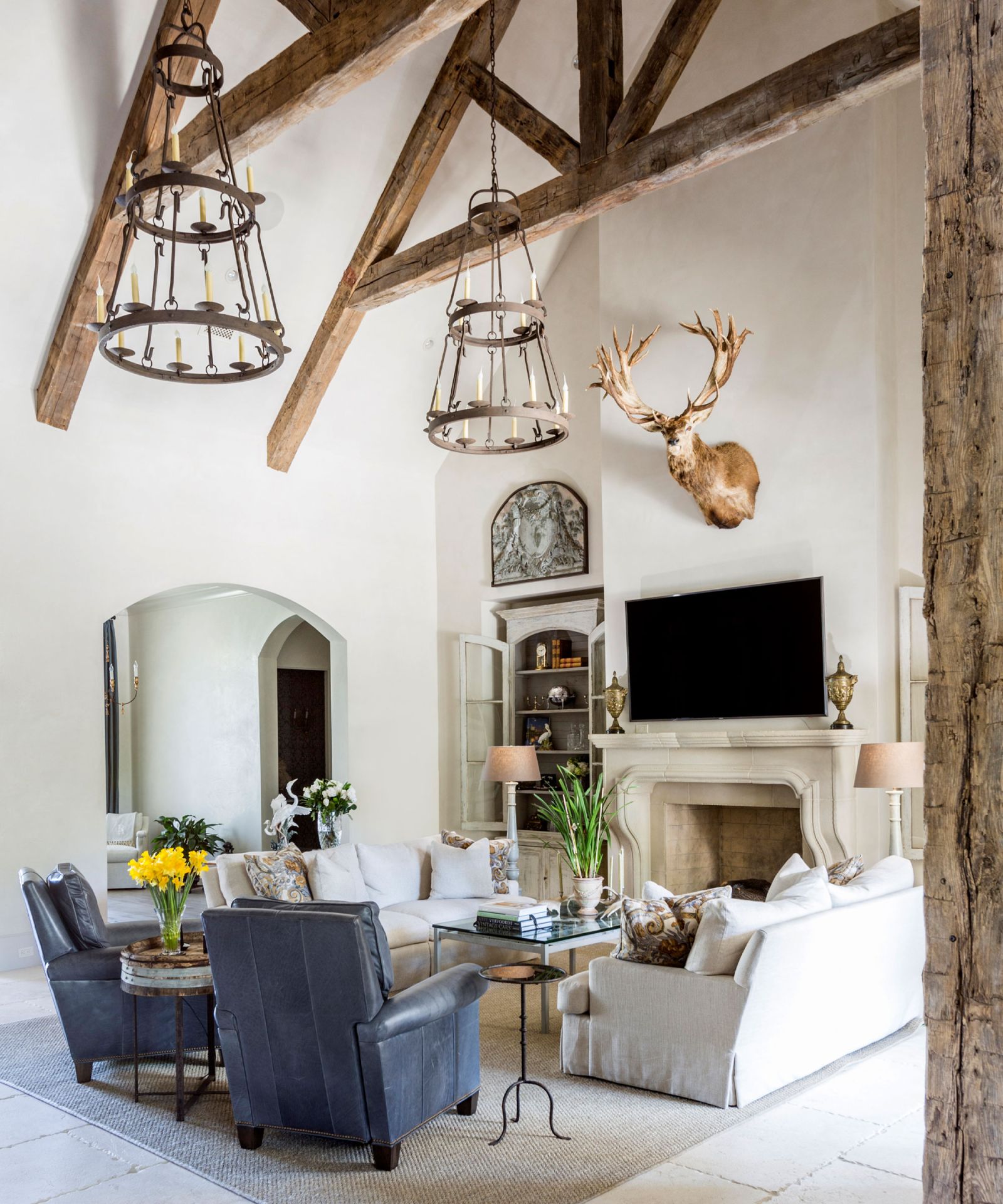 Fireplace Mantle-Turned TV Stand with Bronze Urns