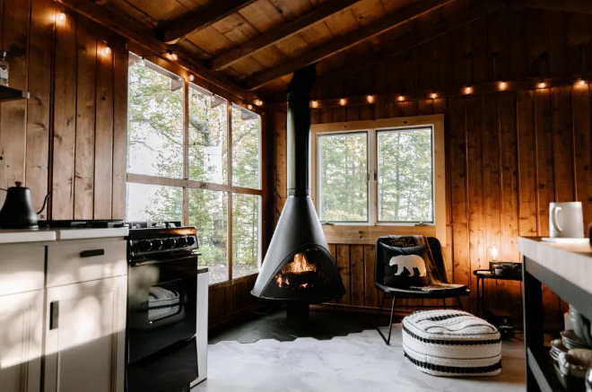 Fireplace with a Hanging Cone and Rustic Wooden Walls