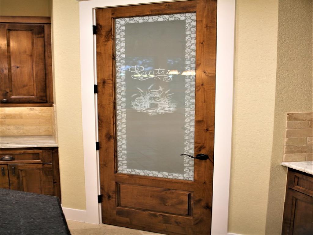 Patterned Frosted Glass in a Wooden Pantry Door