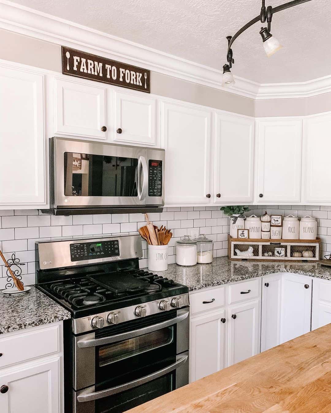Stainless Steel Appliances with White Subway Tiles