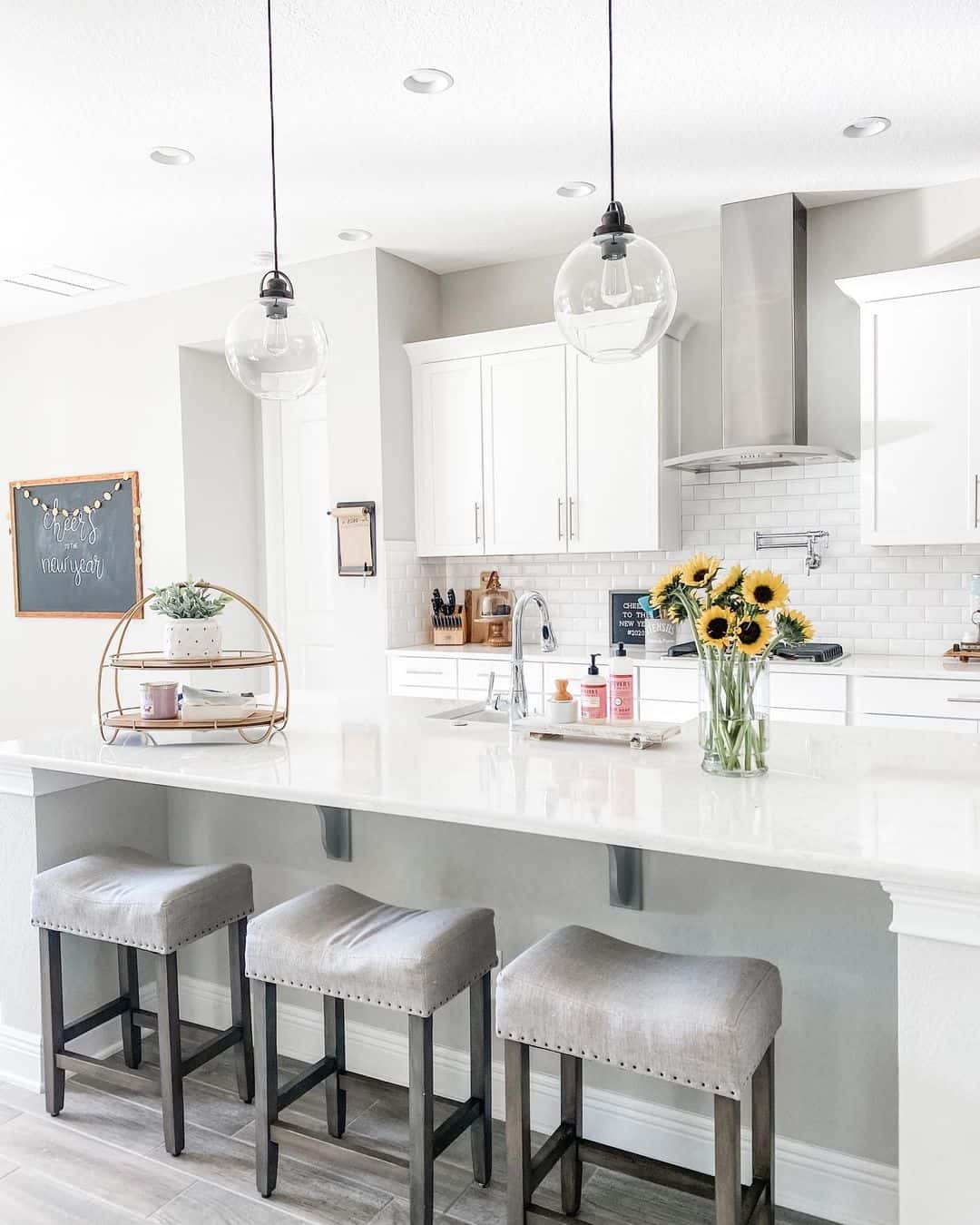 White Subway Tile Backsplash and Upholstered Stools