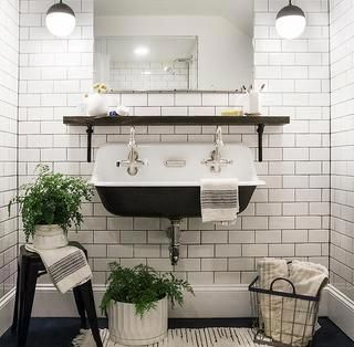 White Subway Tile Bathroom with Dark Flooring