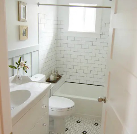 White Subway Tile Bathroom with Honeycomb Tile Flooring