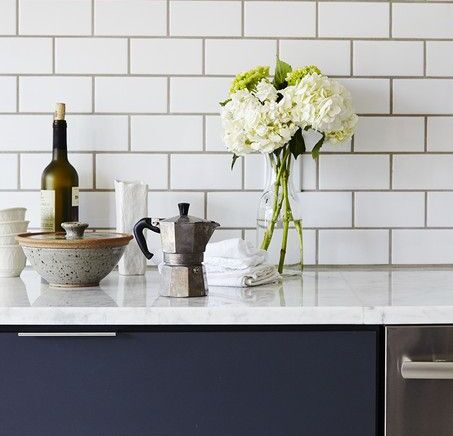 White Subway Tile Kitchen with Matte Blue Cabinets