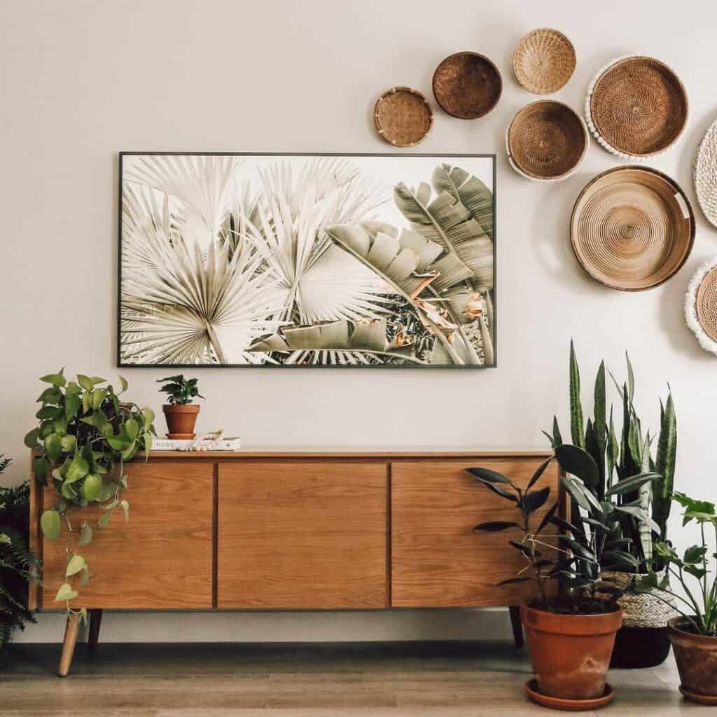 Wooden Sideboard with Foliage and Basket Wall Decor